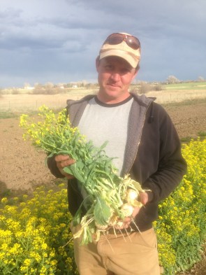 Wyatt holding flowering turnips